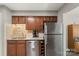 Kitchen features stainless steel appliances and modern design at 6605 Point Comfort Ln, Charlotte, NC 28226