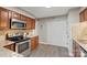 Cozy kitchen with granite counters, stainless steel appliances, and tiled backsplash at 6605 Point Comfort Ln, Charlotte, NC 28226