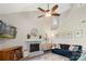 Living room features a brick fireplace, modern decor, and hardwood floors at 6605 Point Comfort Ln, Charlotte, NC 28226