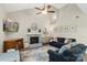 This living room has a brick fireplace, high ceiling, and plenty of room for to play at 6605 Point Comfort Ln, Charlotte, NC 28226