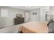 Calm main bedroom offering a dresser, closet and bathroom access, and a fan at 6605 Point Comfort Ln, Charlotte, NC 28226