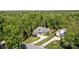 Aerial view of a beautiful home surrounded by lush greenery and mature trees at 6743 Fox Ridge Cir, Davidson, NC 28036