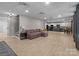 Finished basement with a comfortable lounge area and a kitchenette, perfect for entertaining or relaxing at 6743 Fox Ridge Cir, Davidson, NC 28036