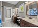 Bathroom featuring double vanity, framed mirrors, and walk-in shower, providing a functional and elegant space at 6743 Fox Ridge Cir, Davidson, NC 28036
