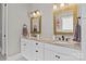 Bathroom showcasing double sinks, granite countertops, and framed mirrors with attractive lighting fixtures at 6743 Fox Ridge Cir, Davidson, NC 28036