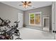 Bright room with exercise equipment, a ceiling fan, and a large window, perfect for a home gym or workout area at 6743 Fox Ridge Cir, Davidson, NC 28036