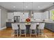 Lovely kitchen with granite countertops, stainless steel appliances, and a center island with chairs at 6743 Fox Ridge Cir, Davidson, NC 28036