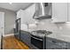 Modern kitchen with stainless steel appliances, granite countertops, and stylish cabinetry at 6743 Fox Ridge Cir, Davidson, NC 28036
