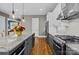 Modern kitchen features stainless steel appliances, granite countertops, and an island for dining at 6743 Fox Ridge Cir, Davidson, NC 28036