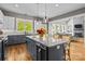 Gorgeous kitchen featuring granite countertops, stainless steel appliances, and a large island with seating at 6743 Fox Ridge Cir, Davidson, NC 28036