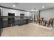 Basement kitchen with sleek cabinetry, modern appliances, and a cozy dining nook for casual meals at 6743 Fox Ridge Cir, Davidson, NC 28036