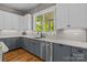 Charming kitchen features granite countertops, stainless steel appliances, and a view to outdoors at 6743 Fox Ridge Cir, Davidson, NC 28036