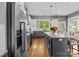 Beautiful kitchen features stainless appliances, a large island with seating, and hardwood floors at 6743 Fox Ridge Cir, Davidson, NC 28036