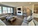 Inviting living area featuring a modern fireplace, stylish furnishings, and large windows at 7108 Brookview Ln, Sherrills Ford, NC 28673