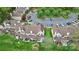 Aerial view of townhomes with back patios, green spaces, and parking areas at 8221 Pineville Matthews Rd # A, Charlotte, NC 28226