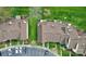 Aerial view of townhomes showcasing rooflines, manicured landscaping, and lush green spaces at 8221 Pineville Matthews Rd # A, Charlotte, NC 28226