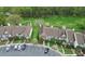 Aerial view of townhomes showcasing landscaping, parking, and tree coverage at 8221 Pineville Matthews Rd # A, Charlotte, NC 28226