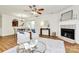Spacious living room featuring a fireplace, stylish decor, and lots of natural light from windows at 8221 Pineville Matthews Rd # A, Charlotte, NC 28226