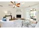 Bright living room featuring a fireplace, sliding glass doors, and stylish decor with wood floors at 8221 Pineville Matthews Rd # A, Charlotte, NC 28226