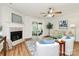 Comfortable living room featuring fireplace, sliding glass doors, and a neutral color palette at 8221 Pineville Matthews Rd # A, Charlotte, NC 28226