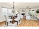 Inviting living room featuring a fireplace, wood floors, and ample natural light from large windows at 8221 Pineville Matthews Rd # A, Charlotte, NC 28226