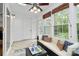 Bright sun room with many windows, seating and tile floor at 8221 Pineville Matthews Rd # A, Charlotte, NC 28226