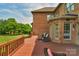 Wood deck with outdoor seating provides an ideal spot for enjoying backyard views at 9008 Skipaway Dr, Waxhaw, NC 28173