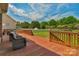 Wood deck features comfortable outdoor seating, beautiful landscaping, and expansive backyard at 9008 Skipaway Dr, Waxhaw, NC 28173