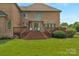 Expansive backyard featuring a multi-tiered wood deck with seating area and lawn at 9008 Skipaway Dr, Waxhaw, NC 28173
