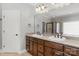Bathroom features a double sink vanity, large mirror, and tiled shower/tub combo at 9008 Skipaway Dr, Waxhaw, NC 28173