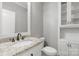 Clean bathroom with a single sink vanity with granite countertop and built in cabinet at 9008 Skipaway Dr, Waxhaw, NC 28173