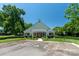 Community clubhouse featuring accessible parking, manicured landscaping, and versatile space for gatherings at 9008 Skipaway Dr, Waxhaw, NC 28173