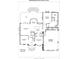 First floor plan of 9008 Skipaway Drive showing spacious living room, dining room, kitchen, primary bedroom and garage at 9008 Skipaway Dr, Waxhaw, NC 28173