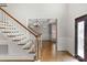 Grand foyer with a staircase, hardwood floors, and a view into the formal dining room at 9008 Skipaway Dr, Waxhaw, NC 28173