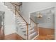 Staircase leading to a formal dining room, exuding elegance and charm at 9008 Skipaway Dr, Waxhaw, NC 28173