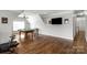 Spacious game room with billiard table, hardwood floors, and large flat screen tv at 9008 Skipaway Dr, Waxhaw, NC 28173