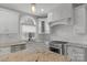 Bright kitchen featuring white cabinets, granite countertops, stainless steel appliances, and ample natural light at 9008 Skipaway Dr, Waxhaw, NC 28173