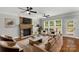 Spacious living room features a stone fireplace, hardwood floors, and ample seating at 9008 Skipaway Dr, Waxhaw, NC 28173