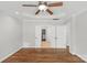 Spacious main bedroom featuring tray ceilings, a ceiling fan, and a walk-in closet at 9008 Skipaway Dr, Waxhaw, NC 28173