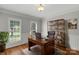 Cozy office space with hardwood floors, a wooden desk, and bright natural light at 9008 Skipaway Dr, Waxhaw, NC 28173