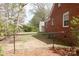 Spacious backyard with a chain-link fence and mature trees, offering privacy and shade at 920 N Sixth St, Albemarle, NC 28001