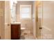 A well-lit bathroom with a modern vanity and a glass-enclosed shower at 920 N Sixth St, Albemarle, NC 28001