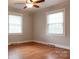 Bedroom featuring two large windows that provide natural light and hardwood floors at 920 N Sixth St, Albemarle, NC 28001