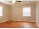 A cozy bedroom with natural light, hardwood floors and a ceiling fan at 920 N Sixth St, Albemarle, NC 28001