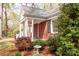 Inviting front porch with white pillars and brick details, perfect for enjoying the outdoors at 920 N Sixth St, Albemarle, NC 28001