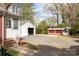Detached garage and outbuilding, offering ample parking and storage space in a private setting at 920 N Sixth St, Albemarle, NC 28001