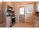 Well-equipped kitchen with stainless steel appliances, tile backsplash, and a convenient side entrance at 920 N Sixth St, Albemarle, NC 28001