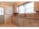 A bright kitchen with modern tile backsplash, stainless steel sink, and ample counter space at 920 N Sixth St, Albemarle, NC 28001