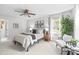 Bright bedroom features a ceiling fan, natural light, and tasteful decorations at 9319 Harps Mill Ct, Charlotte, NC 28270
