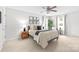 Bright bedroom features a ceiling fan, natural light, and tasteful decorations at 9319 Harps Mill Ct, Charlotte, NC 28270